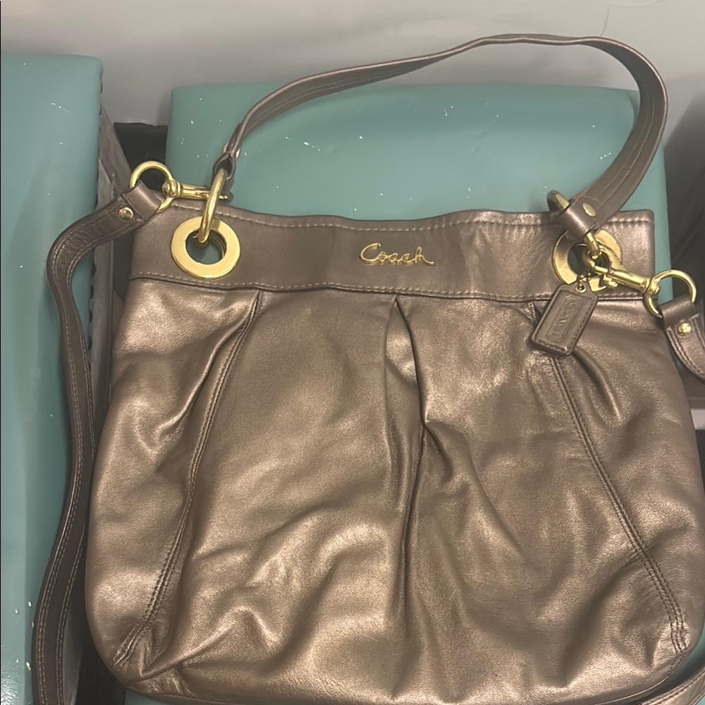 Coach Gold Shoulder Bag with Luxurious Leather and Casual Silhouette